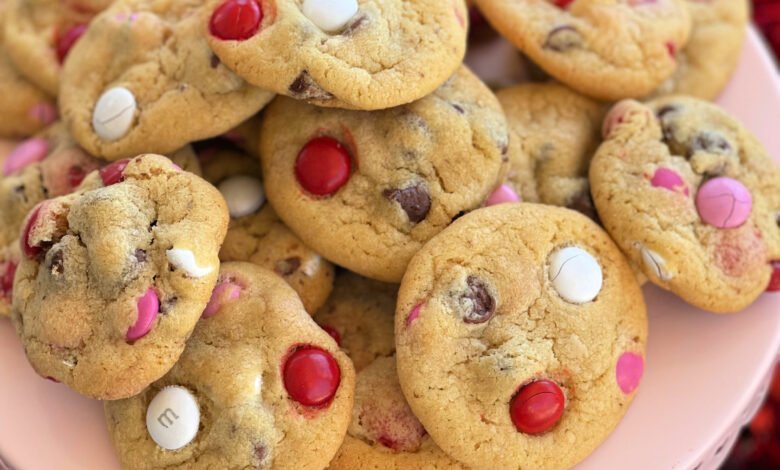 a stack of strawberry cookies ready to serve from a cutting board.